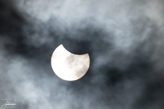 It is saturday 29th of March 2025 and around noon, the moon is shifting in front of the sun creating a sun eclipse. It is cloudy which is in this case a benefit creating nice scenes. The small spot in the upper left of the sun is a sunspot. Sunspots are temporary, dark spots on the sun's surface. They are cooler than the surrounding areas and are caused by strong magnetic activity. and has the size of the earth. Next eclipse will be in august 2026 and 2027.