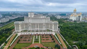Bucharest's skyline tells a story of contrasts and ambition. The immense, neo-classical Palace of the Parliament — an enduring symbol of a bygone era — looms alongside the magnificent People's Salvation Cathedral, whose golden dome now gleams over the city. A truly monumental view of Romania's capital.